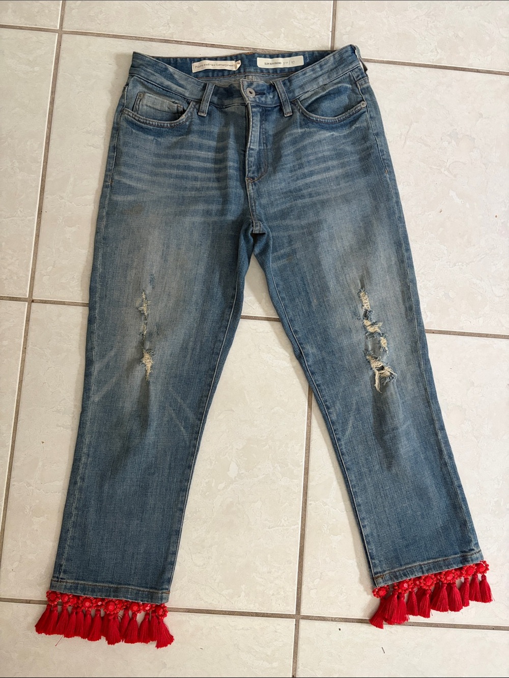Pilcro and the Letterpress Distressed Blue Cropped Jeans with Red Tassel Hem